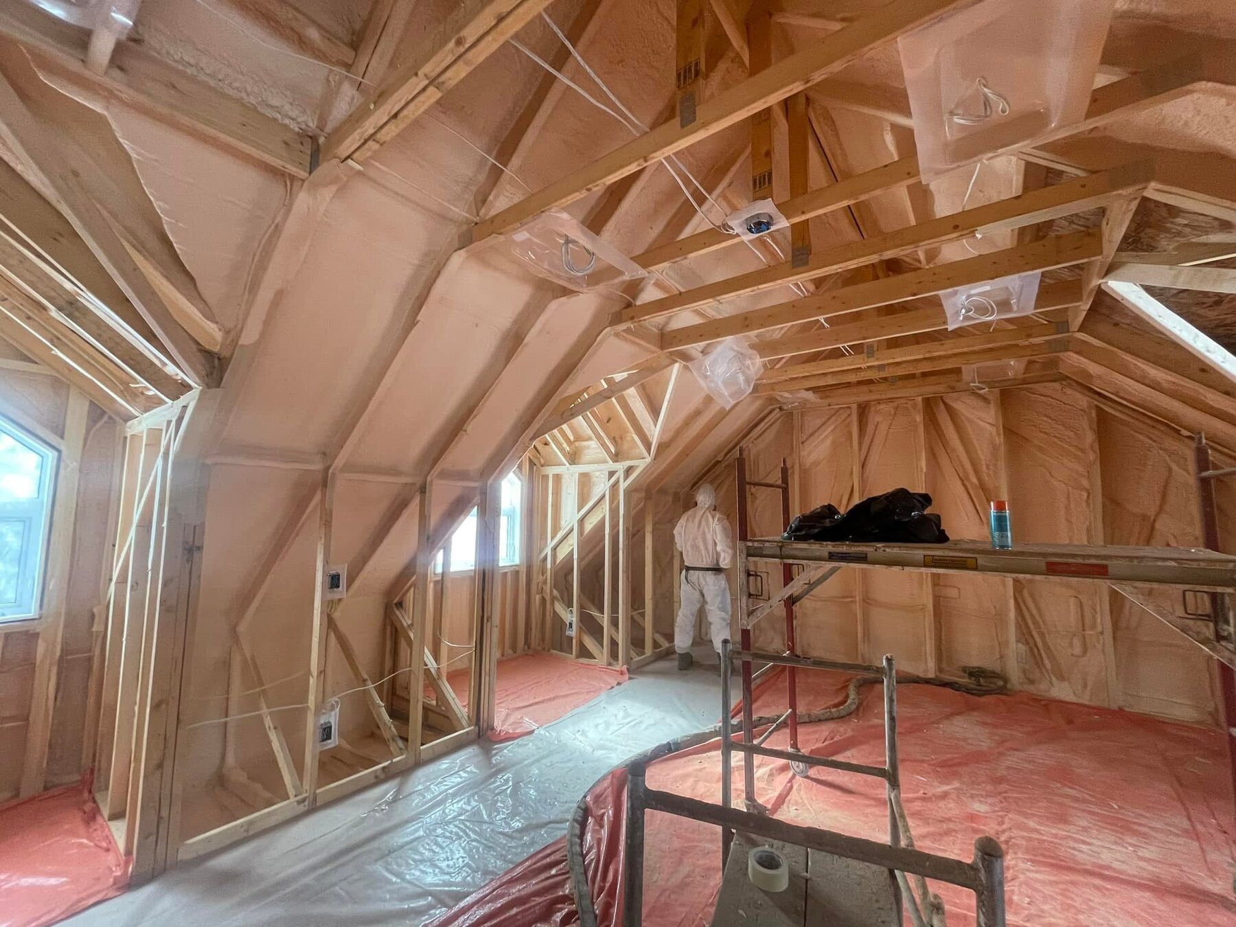 Vaulted ceiling of a second-floor bonus suite above a garage, fully insulated with closed-cell spray foam