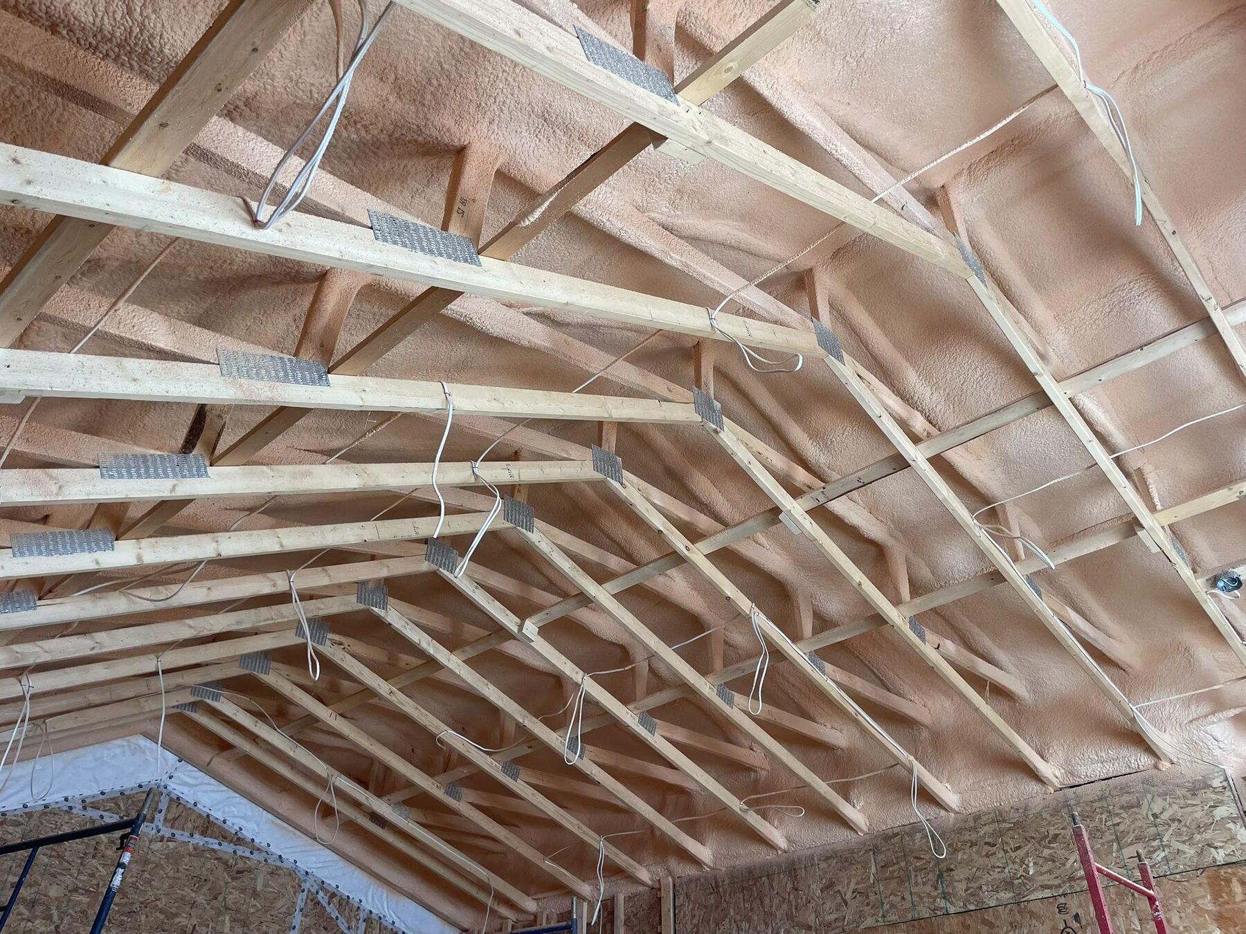 Shallow vaulted ceiling cavity fully insulated with closed-cell spray foam against the rafters